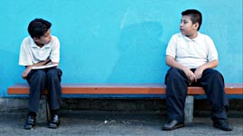 Moises and Friend Sitting on a Bench